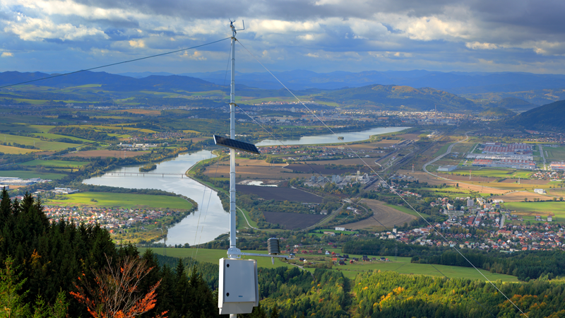 Vaisala Automatic Weather Station AWS810 with nature views in the background.