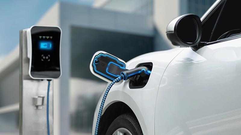 Electric car connected to charging station
