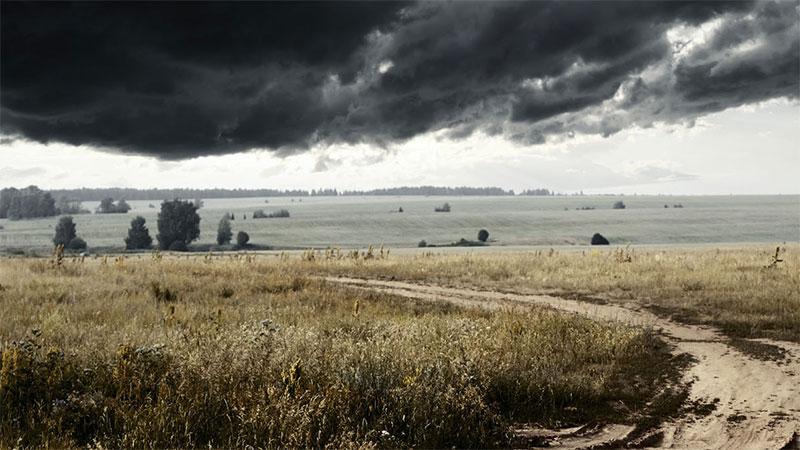 Dark clouds over a field