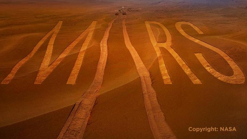 Journey to Mars - rover has written "Mars" with tire tracks