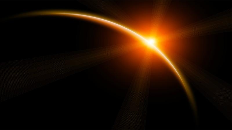 Rising sun behind planet
