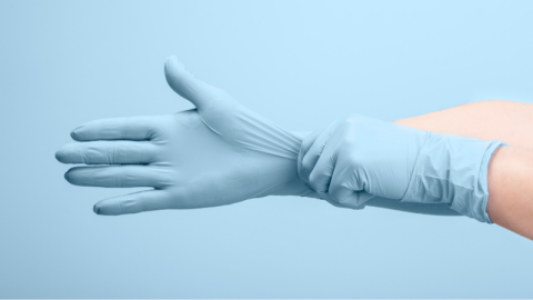 Hands with medical gloves