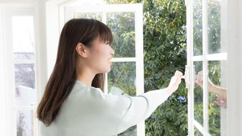 Woman opening a door