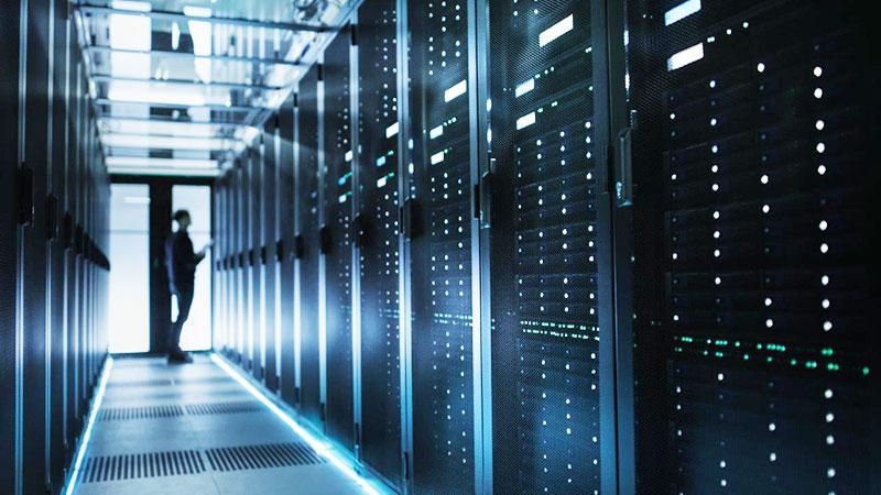 Man in datacenter corridor