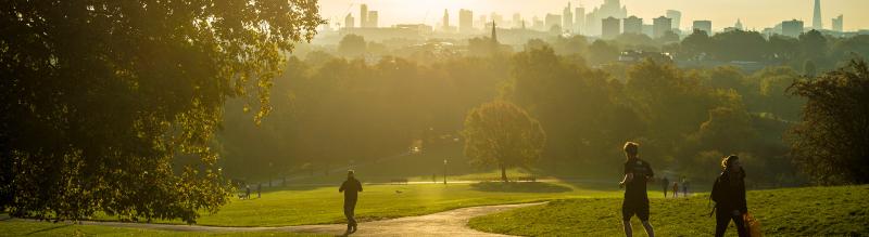 People running in a city park