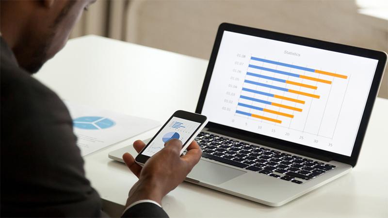 Financial charts on a laptop
