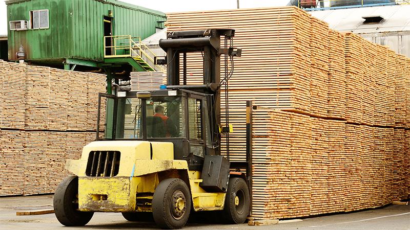 Machine lifting lumber