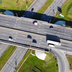 Top view of the highway highway in the city with cars